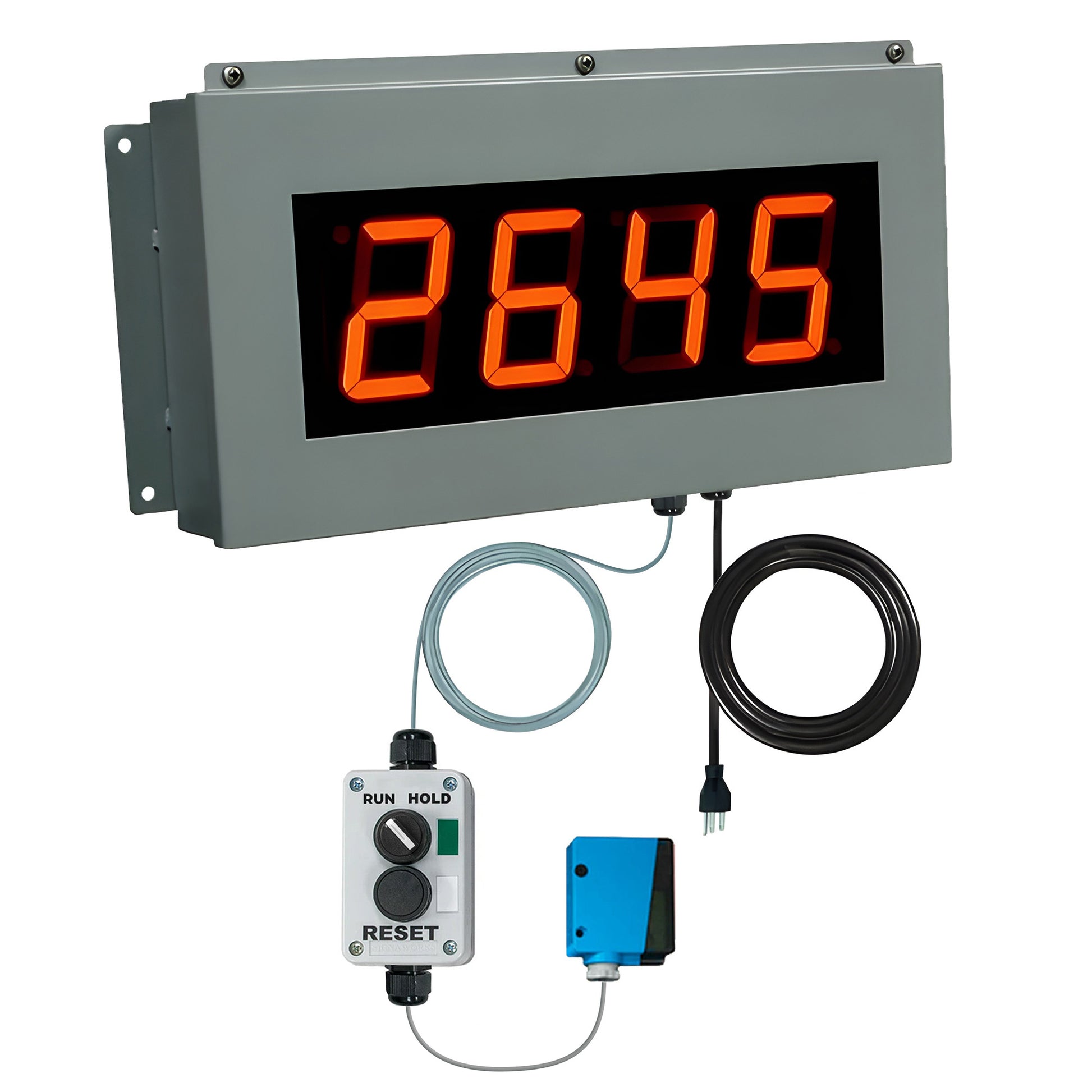 Digital display with red numbers control switchbox and photo eye on a white background