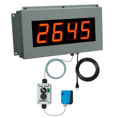 Digital display with red numbers control switchbox and photo eye on a white background